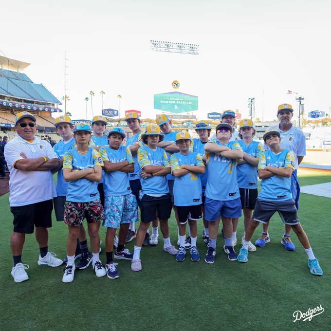 The El Segundo Little League team poses for a photo on the field.