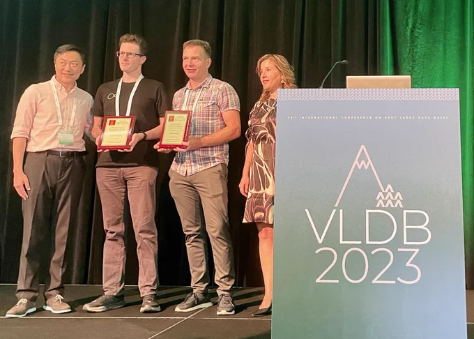 Gábor Szárnyas (2nd from left) and Peter Boncz (3rd from left) from CWI, on the occasion of the VLDB 2023 Best Paper Award in Vancouver. 