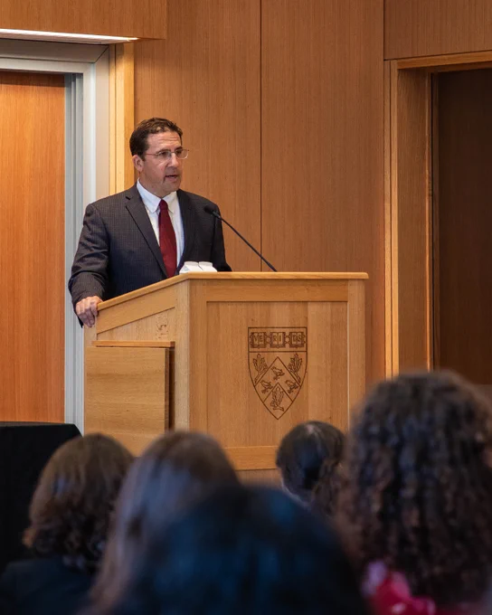 Interim Dean David Holland addresses the crowd from the podium.