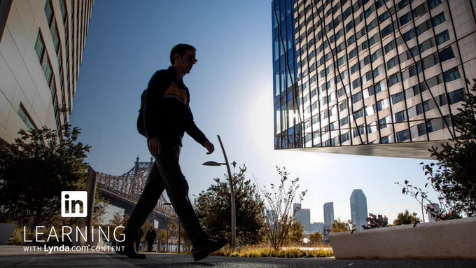 student walking across NY Tech campus