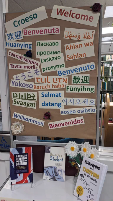 An image of the library display board with welcome in many languages.