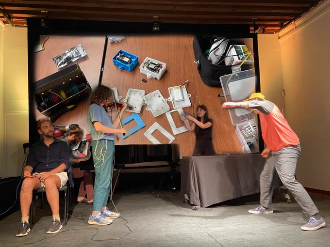 Musicians and makers engaged in a performance with sensors and @adafruit #feather and #huzzah
