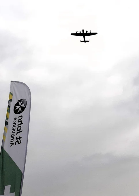 Fly past by a Lancaster bomber. Sir Barnes Wallis was born in Ripley and Lancasters were used in the low flying Operation Chastise raids on the Ruhr Valley dams in WW2 with Wallis's 'Bouncing Bombs'.