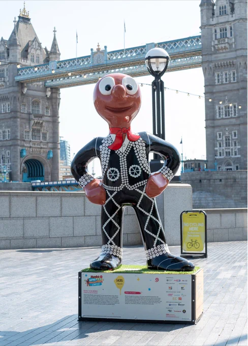 Sandra Russell art’s sculpture of Pearly King Morph on his plinth in front of Tower Bridge in London. A Wild in Art trail.
