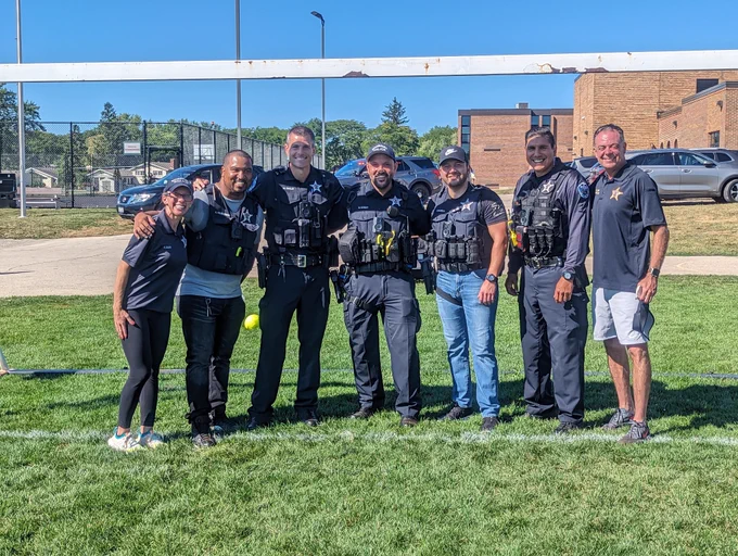 Seven Schaumburg Police Officers smiling for a photo.