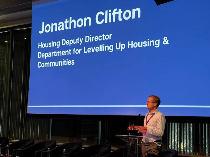 A photo of Jonathon Clifton at the DPMSG conference