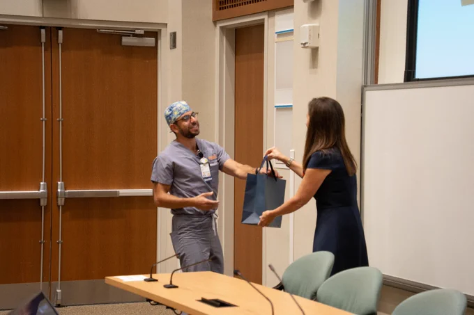 Dr. McNaull presenting resident award. 