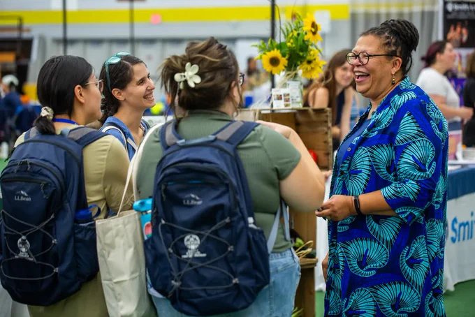 President Sarah Willie-LeBreton smiles as she talks to a group of students during orientation in the ITT