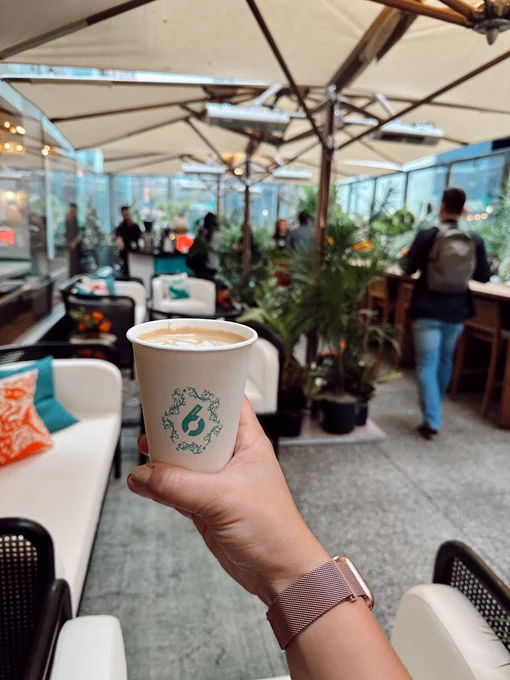holding a cup of coffee