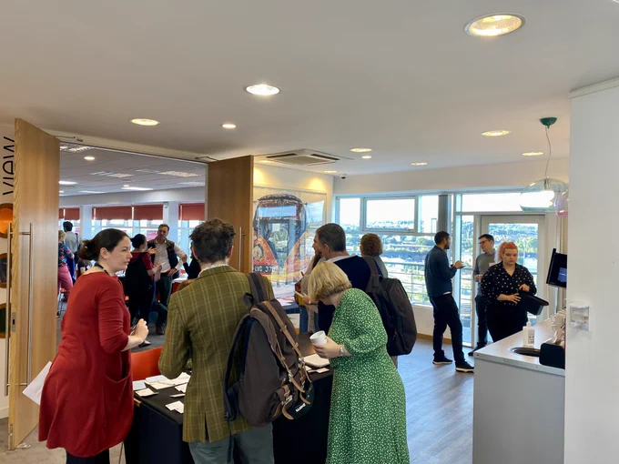 Members of the Yorkshire & Humber Climate Commission register for the meeting at The Studio