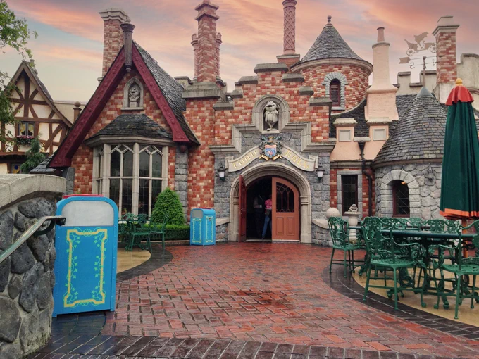 Exterior of Toad Hall Restaurant at Disneyland Paris - with 2 blue trash cans sitting outside