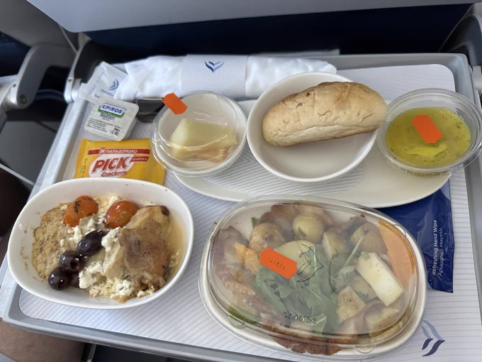 A photograph of the inflight meal, with a variety of lunch dishes.