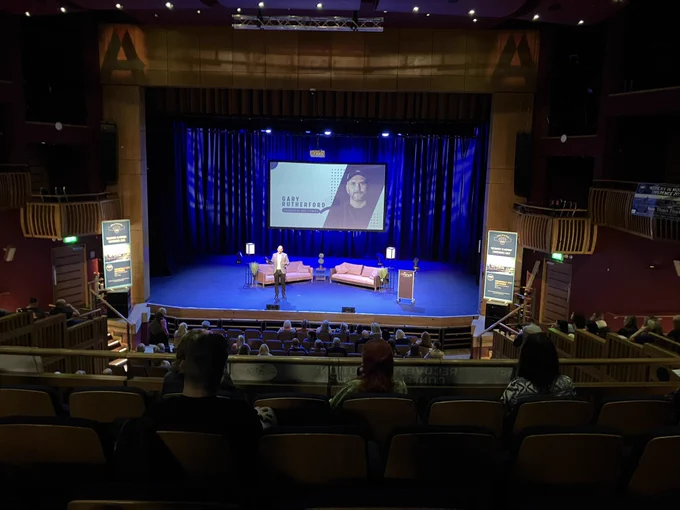 Gary Rutherford founder of arc fitness on stage at the Recovery in Motion conference.