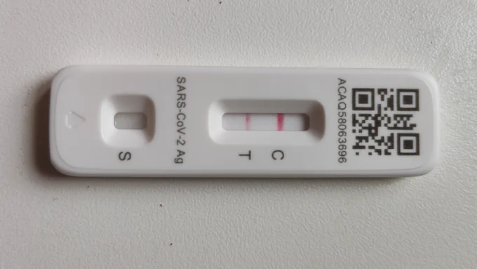 COVID 19 rapid test, showing a positive result