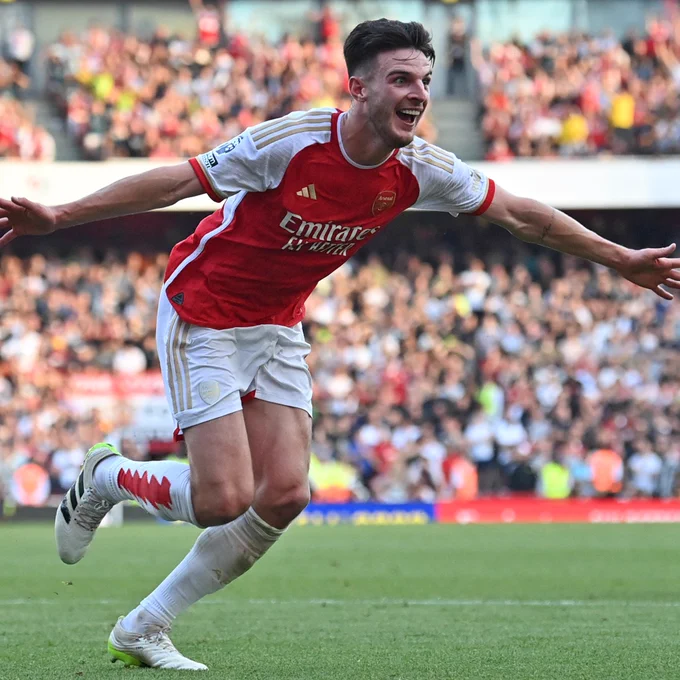 Declan Rice wheels off in celebration after his goal.