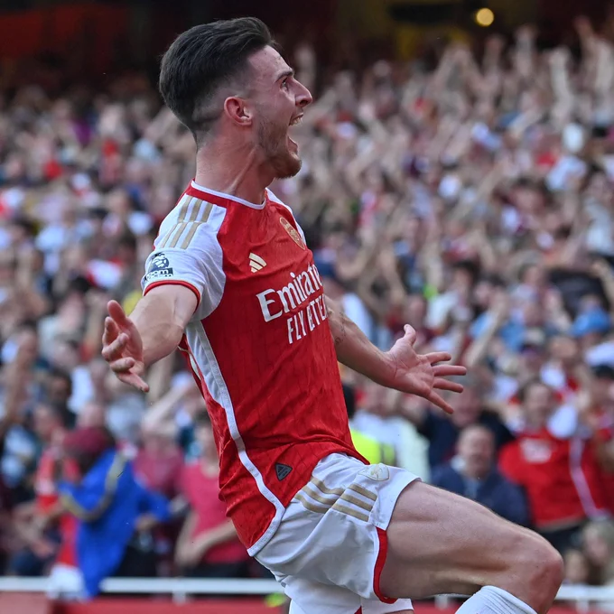 Declan Rice celebrates in front of the North Bank.