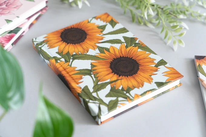 A hardback notebook with a sunflower design