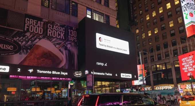 A photo of the Ramp billboard in Times Square shows a tweet from Mahir Anand, which reads Twist by 
@doist >>>>>> discord, slack