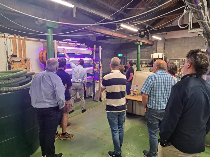 Prof Marcel Jansen explaining the indoor stacked growth system for duckweeds under UV lights.  