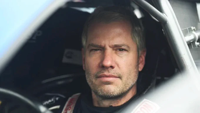 Photo of NHRA pro stock driver and TechForce Foundation Board Member Matt Hartford, sitting in the driver seat of his pro stock racecar.