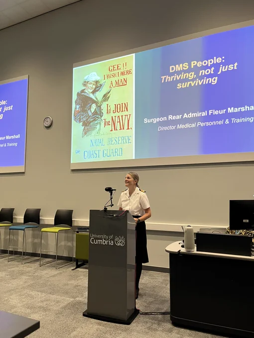 Surg Rear Admiral Fleur Marshall stands at lectern at DMS future leaders conference 2023 talking about DMS People: Thriving, not just Surviving