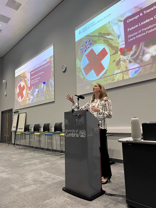 Laura Adams-Foskett stands at lectern at DMS future leaders conference 2023