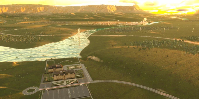 A screenshot from Cities: Skylines 2. A high view overlooking a far landscape. There is a college in the foreground with a large parking lot and many parks and details around it. There is a small town in the background. It is a sunset setting with the sun peeking out behind some distant mountains.