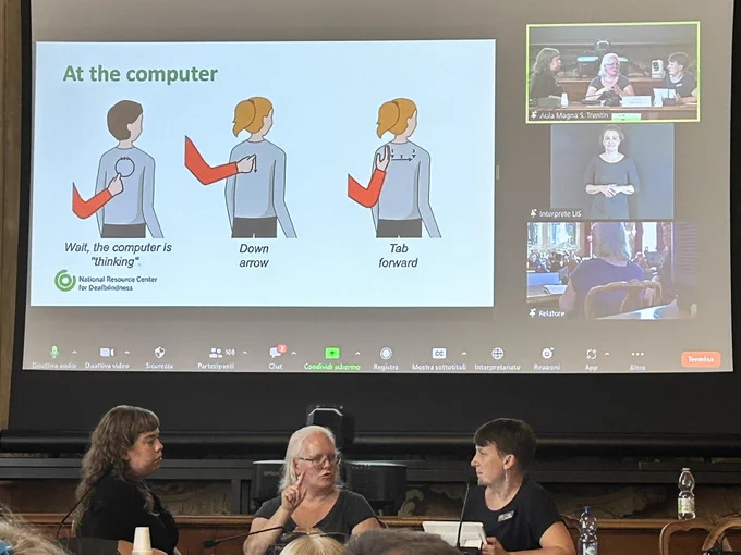 Presenter Linda Eriksson and two tactile sign interpreters sat in front of a screen. I. The screen is a slide of three social haptic signals for use when deafblind person is using a computer.