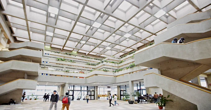 Scott Library atrium with visitors walking around.
