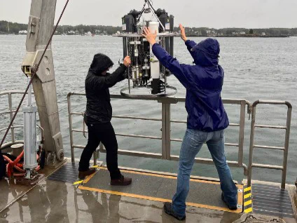 Deploying a cluster of ocean instruments in the Great Bay.