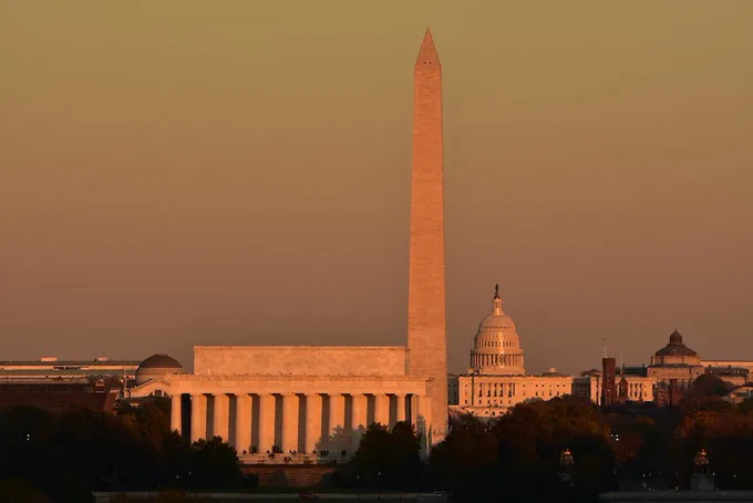 Lincoln Memorial, Washington Monument and Capitol bathed in pink light