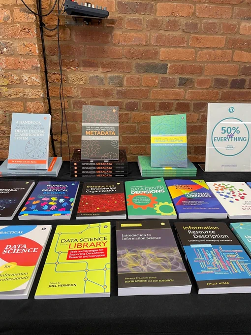 A photo of an exhibition stand with Facet books. 