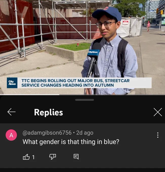 a screenshot of a news video with August in it wearing a blue shirt and cap.

The comment section has a reply that says "What gender is that thing in blue?"