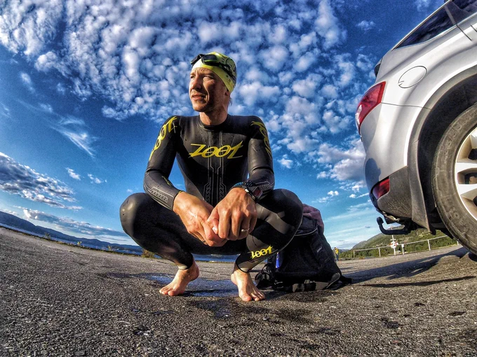 On the beach with with a wetsuit – ready for some open water swimming in the cold Fjord