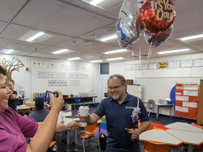 Stacy Kline, Jessica Reyes, and Wendy Hammitt sharing the news with principal Jaime Ramirez of Roosevelt Walker Academy, that he was named outstanding administrator for PLTW for 2023-2024!