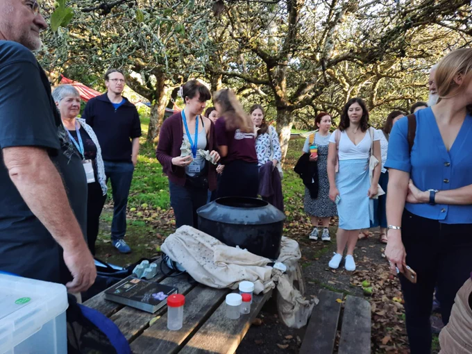 People gathered around a moth trap