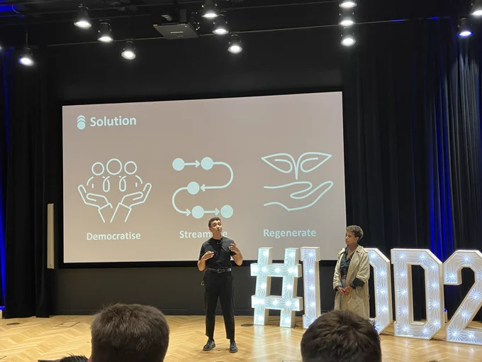 The co-founders of No Impunity delivering a pitch