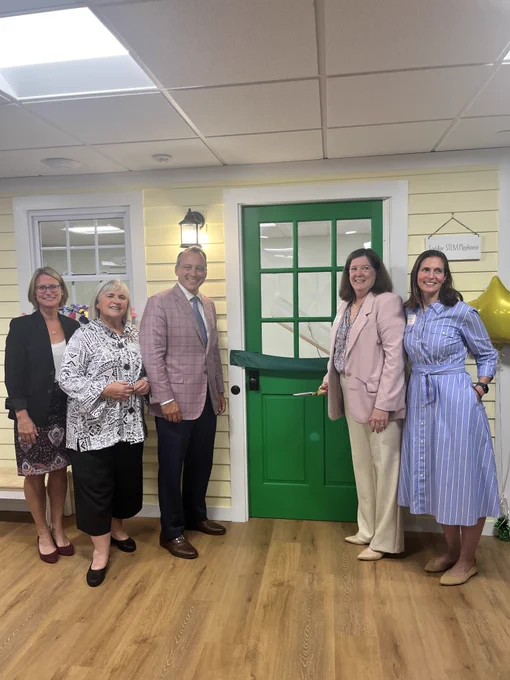 Commissioner Kershaw with Chair Garlick, Chairman Michlewitz, CEO of Ellis Lauren Cook, and Ellis Board Chair Coleen Downs Dinneen 