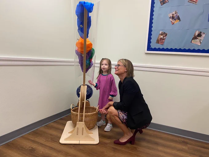 Commissioner Kershaw exploring the STEM lab with a child