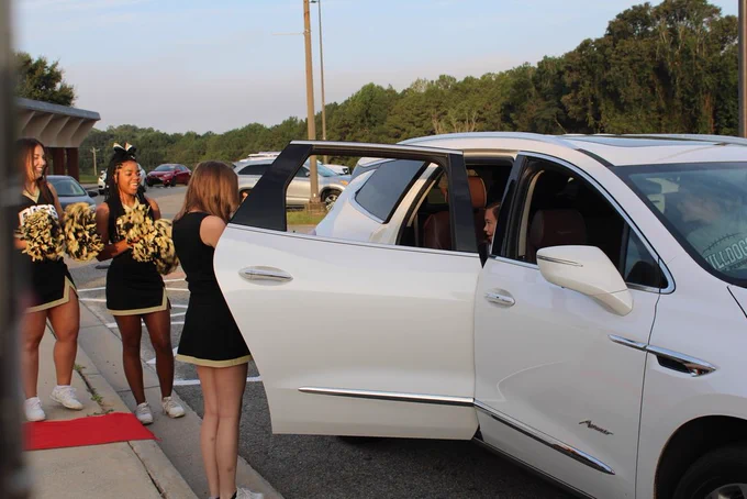 Emery getting out of the car