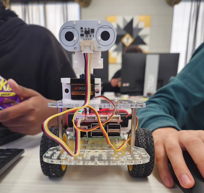 Students build and program robots to reinforce computer science concepts they have learned.
