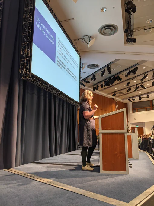Rachel stood on the Accessibility Scotland stage, presenting to the audience 