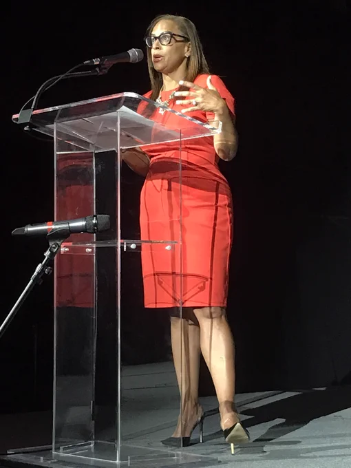 At podium