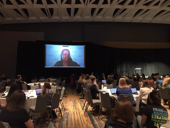 On screen with live audience watching