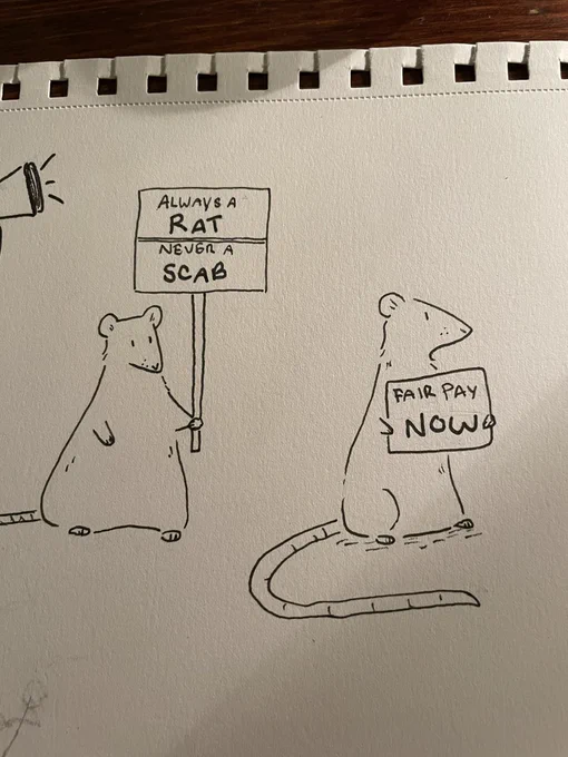 Two rats striking. One is holding a sign that says “always a rat, never a scab.” The other’s says “fair pay now”