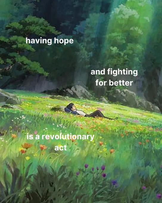 a studio ghibli esque wallpaper that shows a person laying in a field of green and flowers, with the sun shining down 