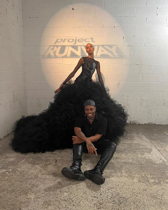 A photo of Bishme Cromartie and his model/design on Project Runway All Stars Season 20.