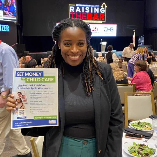 Jazmin Muhammad, Director of Career Education with WorkSource Montgomery, holding the fast -track Child Care Scholarship application process flyer.