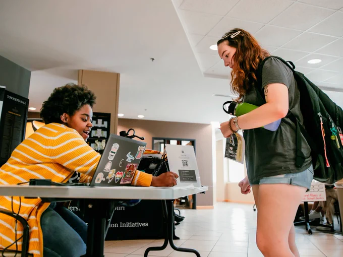 Students talking to an organization