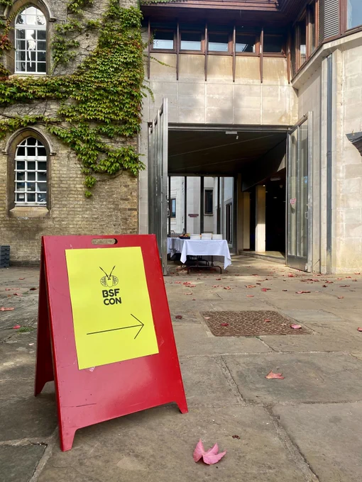 A BSFCON banner stands before the entrance to the Fischer Building